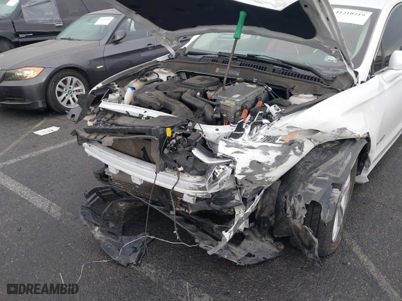 2015 Ford Fusion Titanium Hybrid with VIN 3FA6P0RU3FR247118, listed as a IAAI auction lot 41210219 with 143,348 mi miles. Bid and sale history available at carsss.com. Image 6.