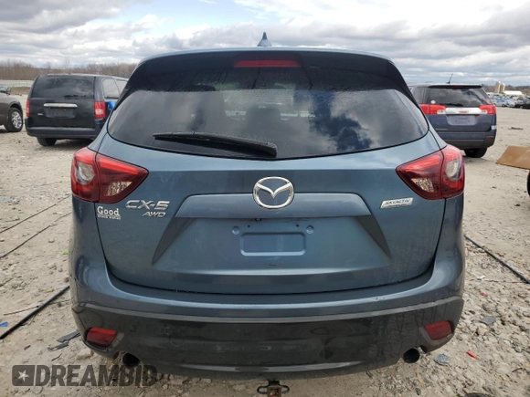 2016 Mazda CX-5 Grand Touring z VIN JM3KE4DY2G0637779, wystawiony jako Copart lot #52001805 z przebiegiem 184 381 mil mil oraz Czysty tytuł • Clean title. Historia ofert i sprzedaży dostępna na DreamBid. Obrazek 6.