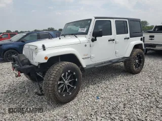2014 Jeep Wrangler Unlimited Sahara with VIN 1C4BJWEG8EL266340, listed as a Copart auction lot 57809465 with 121,191 mi miles and Salvage title. Bid and sale history available at DreamBid. Image 1.