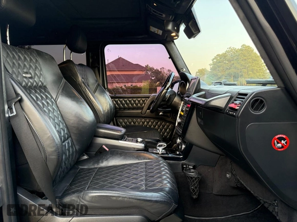 2014 Mercedes-Benz G 63 AMG z VIN WDCYC7DF2EX216331, wystawiony jako Copart lot #58608705 z przebiegiem 128 205 mil mil oraz Tytuł czysty. Historia ofert i sprzedaży dostępna na DreamBid. Obrazek 5.