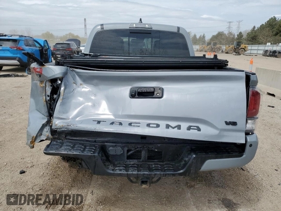 2020 Toyota Tacoma SR5 z VIN 3TMCZ5AN6LM291471, wystawiony jako Copart lot #54352215 z przebiegiem 97 368 mil mil oraz Szkoda całkowita • Salvage title. Historia ofert i sprzedaży dostępna na DreamBid. Obrazek 6.
