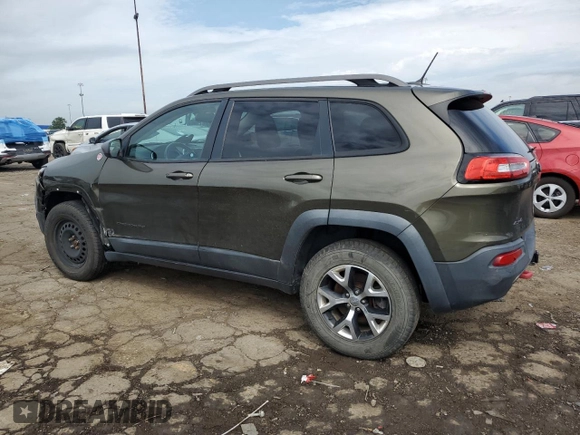 2015 Jeep Cherokee Trailhawk with VIN 1C4PJMBSXFW545534, listed as a Copart auction lot 62236885 with 148,448 mi miles and Clean title. Bid and sale history available at DreamBid. Image 2.