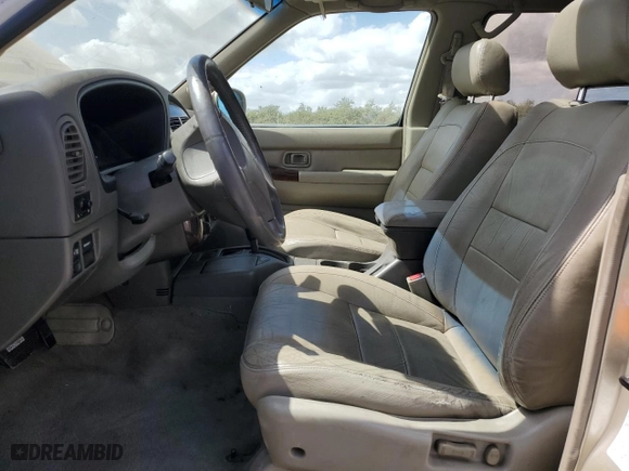 1999 Infiniti QX4 Luxury with VIN JNRAR07Y6XW070437, listed as a Copart auction lot 70798154 with 148,298 mi miles and Salvage Title. Bid and sale history available at carsss.com. Image 7.