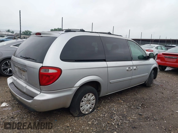 2005 Chrysler Town & Country LX with VIN 2C4GP44R35R152152, listed as a IAAI auction lot 42190551 with 128,239 mi miles and . Bid and sale history available at DreamBid. Image 4.