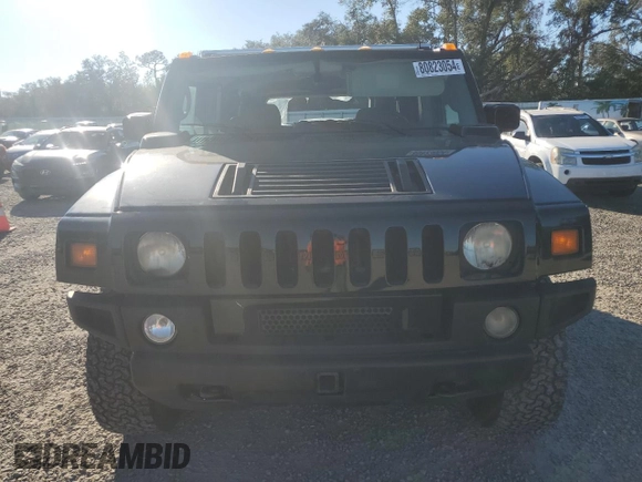 2003 Hummer H2 with VIN 5GRGN23UX3H136571, listed as a Copart auction lot 80823054 with 220,003 mi miles and Salvage Title. Bid and sale history available at carsss.com. Image 5.