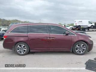 2014 Honda Odyssey Touring with VIN 5FNRL5H94EB127695, listed as a IAAI auction lot 41936109 with 221,786 mi miles and . Bid and sale history available at DreamBid. Image 13.