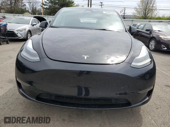 2023 Tesla Model Y Long Range z VIN 7SAYGDEE0PF869710, wystawiony jako Copart lot #52885365 z przebiegiem 13 919 mil mil oraz Szkoda całkowita • Salvage title. Historia ofert i sprzedaży dostępna na DreamBid. Obrazek 5.