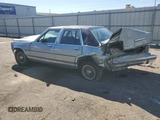 1989 Ford Crown Victoria z VIN 2FABP74F2KX141884, wystawiony jako Copart lot #74934494 z przebiegiem 84 761 mil mil oraz Szkoda całkowita • Salvage title. Historia ofert i sprzedaży dostępna na DreamBid. Obrazek 2.