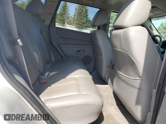2005 Jeep Grand Cherokee Laredo with VIN 1J4GR48KX5C565762, listed as a Copart auction lot 63080115 with 122,349 mi miles and Salvage title. Bid and sale history available at DreamBid. Image 11.