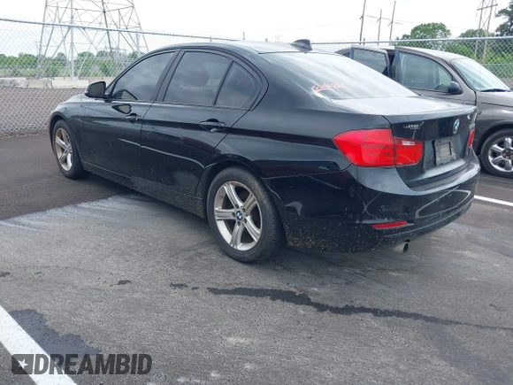 2015 BMW 3 Series 320i with VIN WBA3B1G57FNT05826, listed as a IAAI auction lot 42103193 with 128,800 mi miles. Bid and sale history available at carsss.com. Image 3.