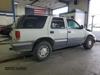 1996 GMC Jimmy SL with VIN 1GKDT13W4T2572197, listed as a Copart auction lot 76535534 with 157,624 mi miles and Salvage Title. Bid and sale history available at carsss.com. Image 3.