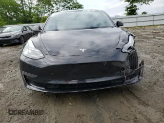 2023 Tesla Model 3 with VIN 5YJ3E1EA3PF451764, listed as a Copart auction lot 58718705 with 33,965 mi miles and Salvage title. Bid and sale history available at DreamBid. Image 5.