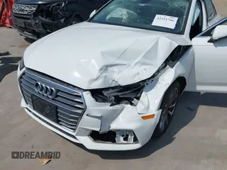 2019 Audi A4 Premium z VIN WAUGMAF48KN007428, wystawiony jako IAAI lot #42311766 z przebiegiem 65 249 mil mil oraz . Historia ofert i sprzedaży dostępna na DreamBid. Obrazek 6.