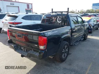 2017 Toyota Tacoma SR5 with VIN 5TFAZ5CN0HX053573, listed as a IAAI auction lot 41797867 with 102,628 mi miles and . Bid and sale history available at DreamBid. Image 4.