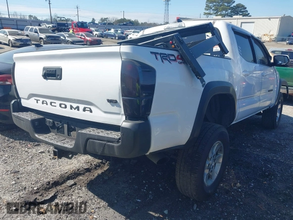 2018 Toyota Tacoma SR with VIN 5TFCZ5AN6JX144056, listed as a IAAI auction lot 41623760 with Not Provided miles and . Bid and sale history available at DreamBid. Image 4.