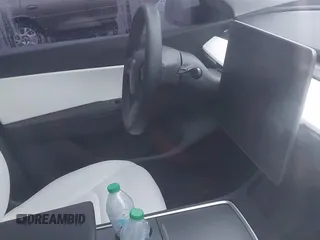 2021 Tesla Model Y Performance z VIN 5YJYGDEF2MF215938, wystawiony jako IAAI lot #41338287 z przebiegiem 63 925 mil mil oraz . Historia ofert i sprzedaży dostępna na DreamBid. Obrazek 17.