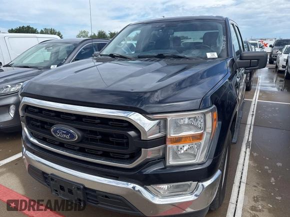 2021 Ford F-150 XL with VIN 1FTEW1CB8MFA73434, listed as a IAAI auction lot 42203245 with 136,878 mi miles. Bid and sale history available at carsss.com. Image 1.