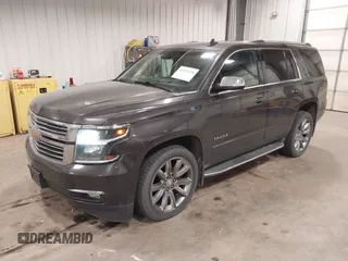 2016 Chevrolet Tahoe LTZ with VIN 1GNSKCKC1GR201155, listed as a IAAI auction lot 42235228 with 184,585 mi miles and . Bid and sale history available at DreamBid. Image 2.