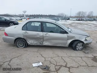 2002 Mitsubishi Lancer ES with VIN JA3AJ26E62U043039, listed as a IAAI auction lot 41600217 with 141,217 mi miles. Bid and sale history available at carsss.com. Image 13.
