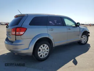 2015 Dodge Journey American Value with VIN 3C4PDCABXFT712192, listed as a Copart auction lot 55680975 with 104,579 mi miles and Salvage Title. Bid and sale history available at DreamBid. Image 3.