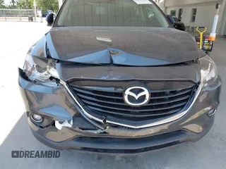 2014 Mazda CX-9 Grand Touring z VIN JM3TB2DA0E0434181, wystawiony jako IAAI lot #42295436 z przebiegiem 78 372 mil mil oraz . Historia ofert i sprzedaży dostępna na DreamBid. Obrazek 6.