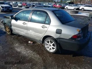 2006 Mitsubishi Lancer OZ-Rally with VIN JA3AJ86E56U000207, listed as a IAAI auction lot 41401698 with 239,219 mi miles. Bid and sale history available at carsss.com. Image 3.