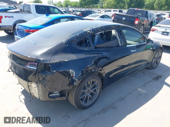 2018 Tesla Model 3 Long Range Battery with VIN 5YJ3E1EA7JF098632, listed as a IAAI auction lot 42002181 with 73,371 mi miles and . Bid and sale history available at DreamBid. Image 4.