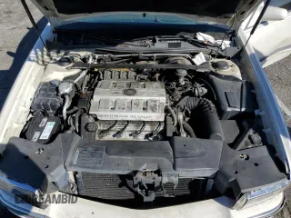 1995 Cadillac Concours z VIN 1G6KF52Y0SU301356, wystawiony jako Copart lot #77372694 z przebiegiem 132 934 mil mil oraz Szkody całkowita. Historia ofert i sprzedaży dostępna na DreamBid. Obrazek 11.