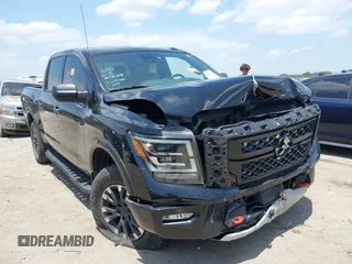 2021 Nissan Titan Pro-4X z VIN 1N6AA1ED6MN524066, wystawiony jako IAAI lot #42435238 z przebiegiem 90 927 mil mil oraz . Historia ofert i sprzedaży dostępna na DreamBid. Obrazek 1.