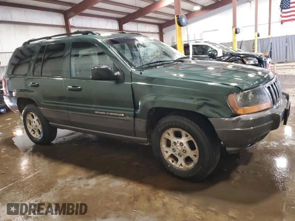 2000 Jeep Grand Cherokee Laredo with VIN 1J4GW48S2YC256123, listed as a Copart auction lot 56015855 with 147,549 mi miles and Salvage title. Bid and sale history available at DreamBid. Image 4.