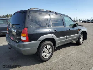 2001 Mazda Tribute LX with VIN 4F2YU09151KM38909, listed as a Copart auction lot 77808264 with 136,005 mi miles and Salvage Title. Bid and sale history available at carsss.com. Image 3.