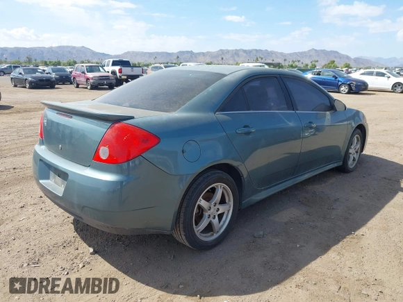 2009 Pontiac G6 1SB with VIN 1G2ZJ57K594261692, listed as a IAAI auction lot 42802373 with 200,469 mi miles and . Bid and sale history available at DreamBid. Image 4.