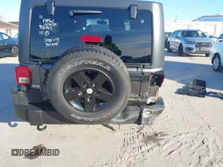 2018 Jeep Wrangler JK Unlimited Sport S with VIN 1C4BJWDG3JL900973, listed as a IAAI auction lot 41239817 with 50,952 mi miles. Bid and sale history available at carsss.com. Image 17.