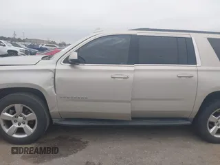 2015 Chevrolet Suburban LT with VIN 1GNSCJKC4FR744208, listed as a IAAI auction lot 41612915 with 87,445 mi miles and . Bid and sale history available at DreamBid. Image 14.
