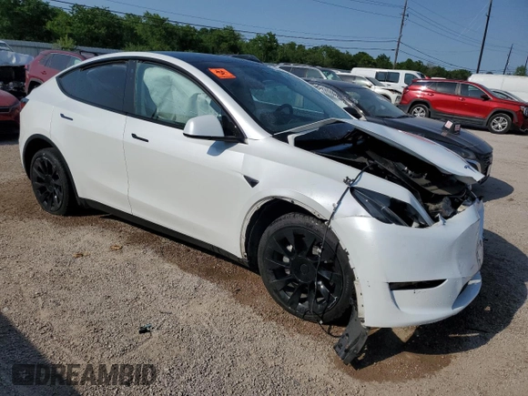 2023 Tesla Model Y Long Range with VIN 7SAYGDEE6PA053274, listed as a Copart auction lot 52865175 with Not Provided miles and Salvage Title. Bid and sale history available at DreamBid. Image 4.