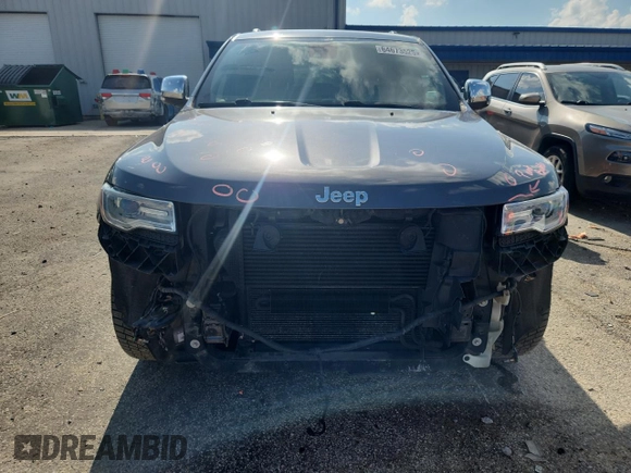 2014 Jeep Grand Cherokee Summit with VIN 1C4RJFJMXEC422730, listed as a Copart auction lot 64673525 with 145,761 mi miles and Non repairable. Bid and sale history available at DreamBid. Image 5.