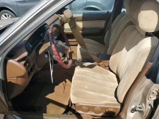 1991 Toyota Camry DLX z VIN 4T1SV21E5MU415356, wystawiony jako Copart lot #74465914 z przebiegiem 74 592 mil mil oraz Szkoda całkowita • Salvage title. Historia ofert i sprzedaży dostępna na DreamBid. Obrazek 7.