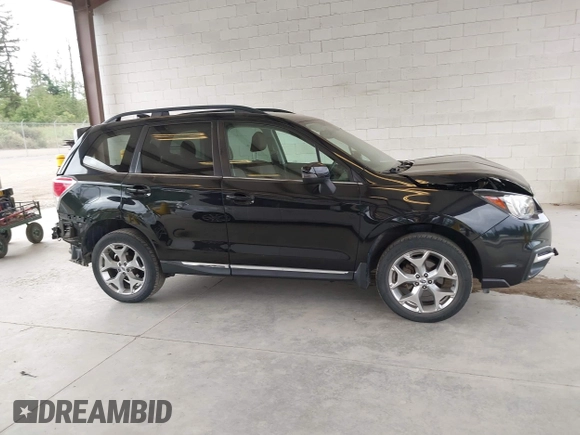 2018 Subaru Forester Touring with VIN JF2SJAWC2JH598982, listed as a IAAI auction lot 42455652 with 57,254 mi miles and . Bid and sale history available at DreamBid. Image 14.