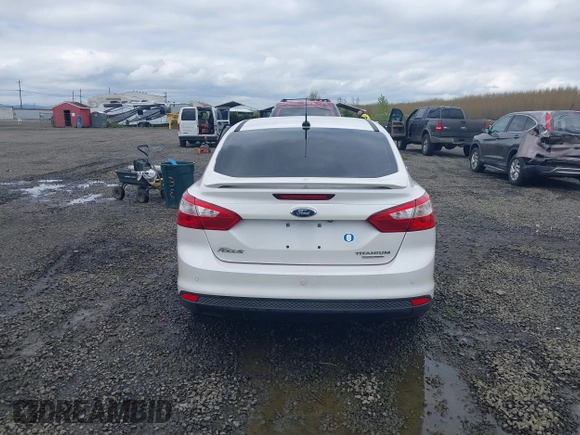 2014 Ford Focus Titanium with VIN 1FADP3J27EL142095, listed as a IAAI auction lot 42004419 with 139,515 mi miles. Bid and sale history available at carsss.com. Image 16.