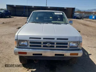 1992 Nissan Frontier SE z VIN 1N6HD16Y8NC358458, wystawiony jako Copart lot #62064905 z przebiegiem 226 678 mil mil oraz Czysty tytuł • Clean title. Historia ofert i sprzedaży dostępna na DreamBid. Obrazek 5.