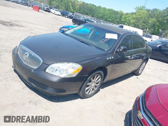 2009 Buick Lucerne CXL with VIN 1G4HD57M59U122626, listed as a IAAI auction lot 42004989 with 184,026 mi miles. Bid and sale history available at carsss.com. Image 2.