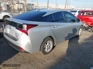 2019 Toyota Prius L Eco with VIN JTDKARFU2K3082593, listed as a IAAI auction lot 41657698 with 239,412 mi miles. Bid and sale history available at carsss.com. Image 4.