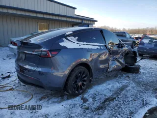2023 Tesla Model Y Long Range with VIN 7SAYGDEE6PF752570, listed as a Copart auction lot 84927794 with 52,297 mi miles and Salvage Title. Bid and sale history available at DreamBid. Image 3.