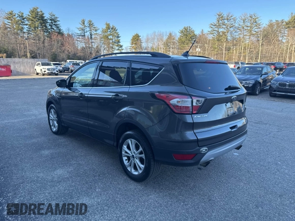 2018 Ford Escape SE with VIN 1FMCU9GD8JUA76991, listed as a IAAI auction lot 42013849 with 213,827 mi miles. Bid and sale history available at carsss.com. Image 3.