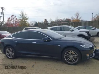 2014 Tesla Model S 60 with VIN 5YJSA1S12EFP42605, listed as a IAAI auction lot 40905031 with 68,155 mi miles and . Bid and sale history available at DreamBid. Image 13.