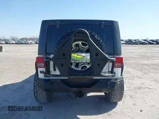 2014 Jeep Wrangler Unlimited Rubicon with VIN 1C4BJWFG1EL167423, listed as a IAAI auction lot 41861109 with 104,669 mi miles. Bid and sale history available at carsss.com. Image 16.