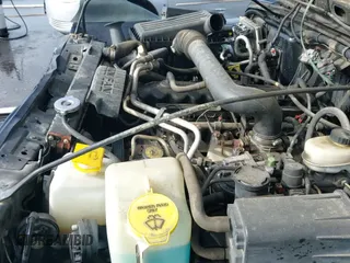 2000 Jeep Wrangler Sport z VIN 1J4FA49S8YP755297, wystawiony jako IAAI lot #42983103 z przebiegiem 181 036 mil mil oraz . Historia ofert i sprzedaży dostępna na DreamBid. Obrazek 19.