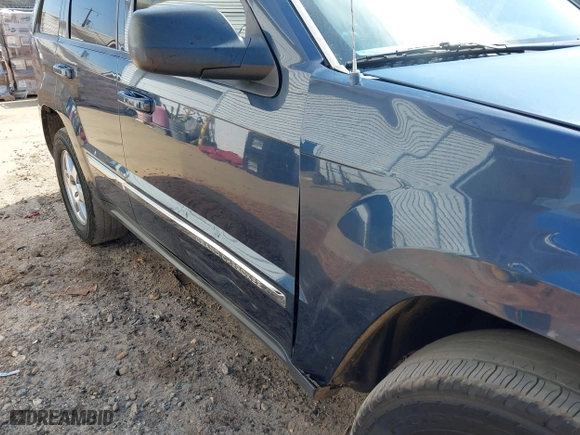 2010 Jeep Grand Cherokee Laredo with VIN 1J4PS4GK0AC112654, listed as a IAAI auction lot 41809445 with 418,301 mi miles. Bid and sale history available at carsss.com. Image 15.