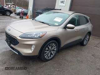 2021 Ford Escape Titanium Hybrid with VIN 1FMCU9DZXMUA66161, listed as a IAAI auction lot 41208651 with 61,198 mi miles and . Bid and sale history available at DreamBid. Image 2.