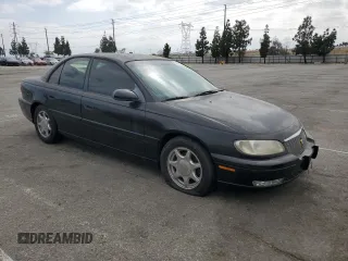 1997 Cadillac Catera z VIN W06VR52RXVR092016, wystawiony jako Copart lot #54067575 z przebiegiem 63 978 mil mil oraz Tytuł czysty. Historia ofert i sprzedaży dostępna na DreamBid. Obrazek 4.